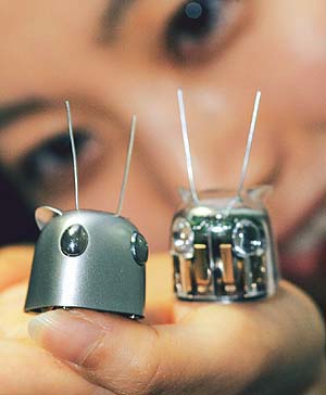 A Seiko Epson Corp. employee shows the companys newly developed ultra-thin microrobots