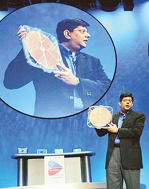 Intel Corporation Vice President Anand Chandrasekher holds up a silicon wafer of Intel chips as he speaks at an event to launch Intels new Centrino Mobile Technology in New York City.