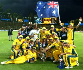 The Australian cricket team poses for photographers with the World Cup