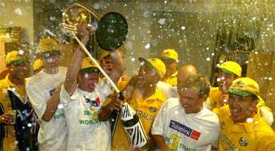 Jubilant Australian players celebrate after beating India in the World Cup finals