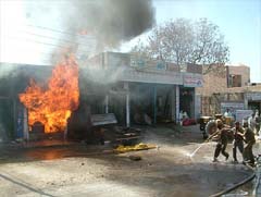The flames rise high from the a shop dealing with paints 