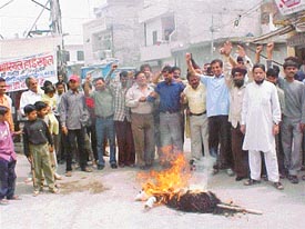 Activists of the All-India Anti-Terrorist Front burn an effigy of terrorism