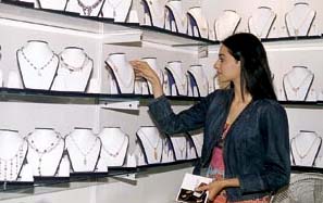 A visitor admires the exotic designs on display at ‘Jewels 2003’
