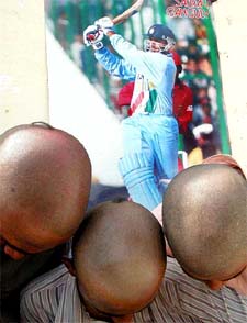 Three young cricket fans got their heads tonsured following India's defeat in the World Cup final