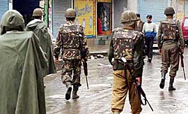 Security personnel patrol Srinagar streets