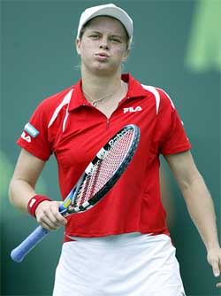 Kim Clijsters of Belgium reacts to an ace served by Serena Williams of USA 