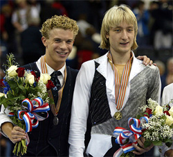 Gold medallist Evgeni Plushenko of Russia stands with silver medallist Timothy Goebel of the USA in the men's free skating event