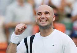 Andre Agassi reacts after winning