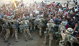 British soldiers from the Light Infantry distribute aid packages