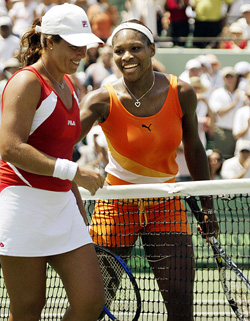Serena Williams of the USA chats with compatriot Jennifer Capriati