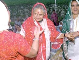 Chief Minister Sheila Dikshit, who turned 65, with supporters at her residence