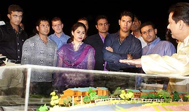 Subrata Roy, Chairman of Sahara Group of Companies, displays a model of the seven-star deluxe suite apartments