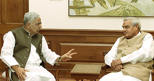 Prime Minister Atal Behari Vajpayee listens to Jammu and Kashmir Chief Minister Mufti Mohammad Sayeed