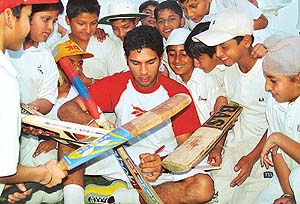 Ace cricketer Yuvraj Singh with budding cricketers after his return from South Africa at DAV Senior Secondary School, Sector-8
