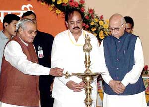 Prime Minister Atal Behari Vajpayee lights the traditional lamp at the inauguration of the BJP National Executive Meeting in Indore on Friday.