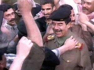 An image from Iraqi television shows what it says is President Saddam Hussein visiting a residential area of Baghdad on Friday.