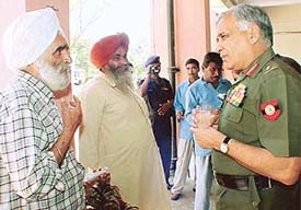 Lieut-Gen S.S. Mehta, GOC-in-Chief, Western Command, listens to ex-servicemen