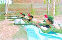 NCC cadets being given rifle training at a camp