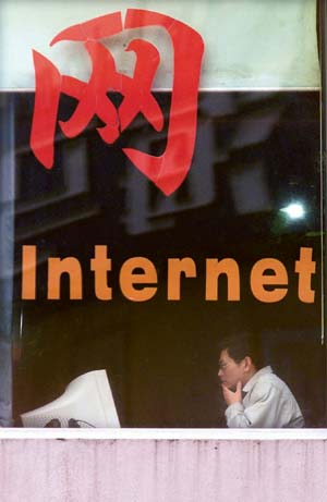 A Chinese youth surfs the Web at an Internet shop in Shanghai