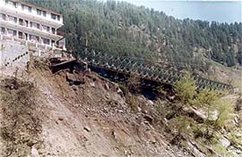 A view of the damaged bridge on the Manali-Naggar (left bank) road on Monday