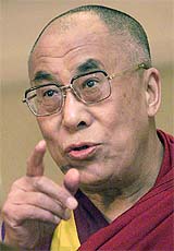 The Buddhist spiritual leader, the Dalai Lama, makes a point while addressing a seminar