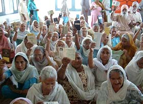 Aged pensioners raise slogans against the Punjab government for not releasing their pensions for one year in Amritsar