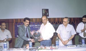 Dr Arun Nigavekar, Chairman, UGC, being welcomed at a seminar on Corporate Social Responsibility organised by Bharatiya Vidyapeeths Institute of Management and Research