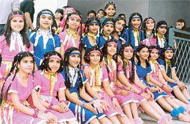 Students of BCM Arya Model Senior Secondary School wait for their turn for a dance performance on the occasion