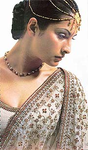 A wedding lehnga designed by Rohit Bal. Siam and white crystals with dabka work impart a kundan-jewellery look to the embroidery