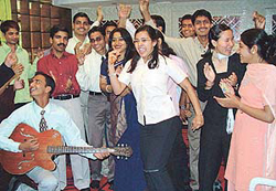 Students of the National Institute of Technical Education sing and dance during their freshers party in Chandigarh on Monday.