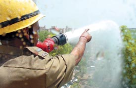 Delhi Fire Service personnel giving a demonstration of firefighting techniques during the Fire Service Week