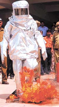 A fireman gives a demonstration of his techniques at Shastri Park metro service station in the Capital on Friday.