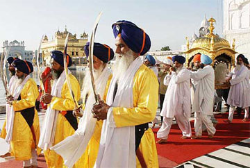 Punj Pyaras and Sikh devotees carrying palki sahib on the occasion of the birth anniversary of ninth Sikh Guru Teg Bahadurji 