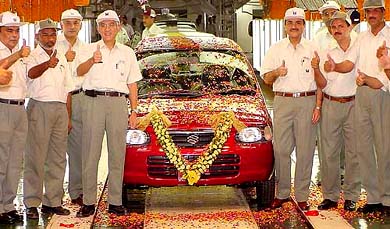 Officials of the Maruti Udyog cheer up to the 4 millionth car rolling out at companys plant in Gurgaon 