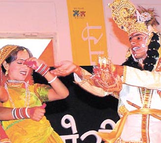 Folk dancers performing at a Bhagidari Mela