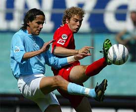 Lazio's Simone Inzaghi and Matteo Abate of Piacenza fight for the ball during their Serie A match