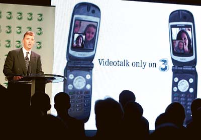 Kevin Russell, chief executive of Telco Hutchison Telecommunications (Australia) Ltd (HTA), speaks at the launch of Asias first third-generation mobile phone service in Sydney. 