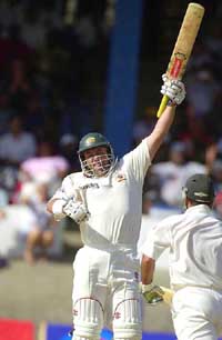 Darren Lehmann of Australia celebrates after scoring his maiden test century