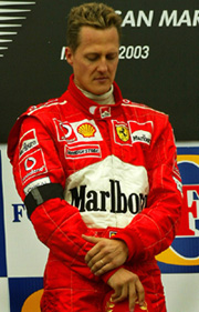 An emotional Michael Schumacher of Germany stands at the winner's podium after winning the San Marino Grand Prix