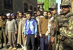 Suspected militants being produced before newspersons at a Border Security Force camp