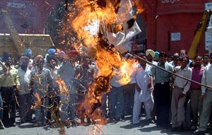 Corporation unions burn an effigy of the Chief Secretary