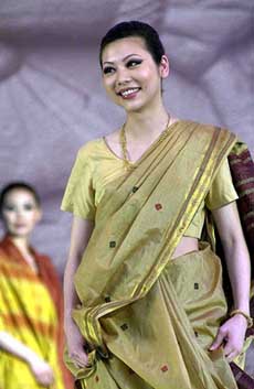 A model displays an outfit inspired by Indian design 
