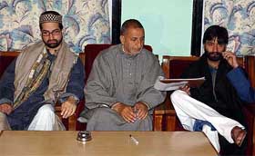 Hurriyat Conference chairman Prof Abdul Ghani Bhat flanked by two senior executive members