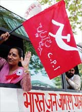 CPI leader Amarjeet Kour waves the party's flag