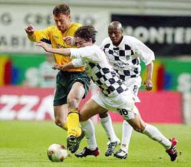 Celtic's Chris Sutton and Filipe Anunciacao challenge for the ball during their UEFA Cup semi-final 2nd leg match against Boavista FC