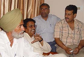 The father of the accused, Mr Balbir Singh, along with victim's son Rakesh Kumar talking to  mediapersons