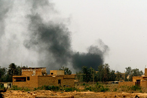 Smoke rises as munitions explode