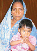 Asha and her daughter, Sangita, wait for the familys breadwinners to be released from the Burail jail