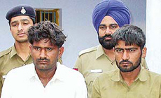 Two members of a gang of highway robbers who were arrested on Sunday. 