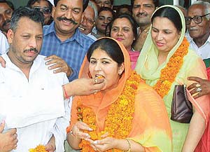 Mr Amardeep Chaudhary, state Secretary of the INLD, greets his wife, Mrs Seema Chaudhary